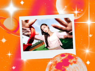 A young woman with red headphones after reading her April 2026 horoscope.