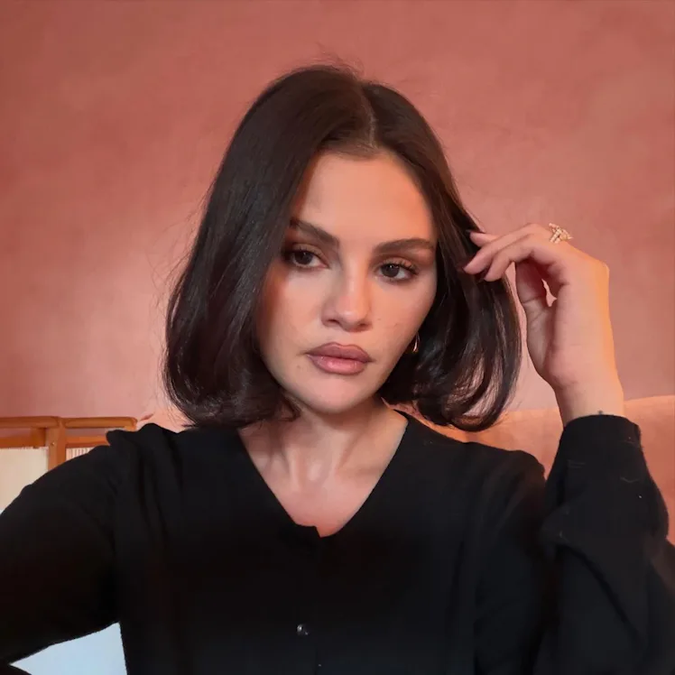 Selena Gomez in a selfie, hand in her hair