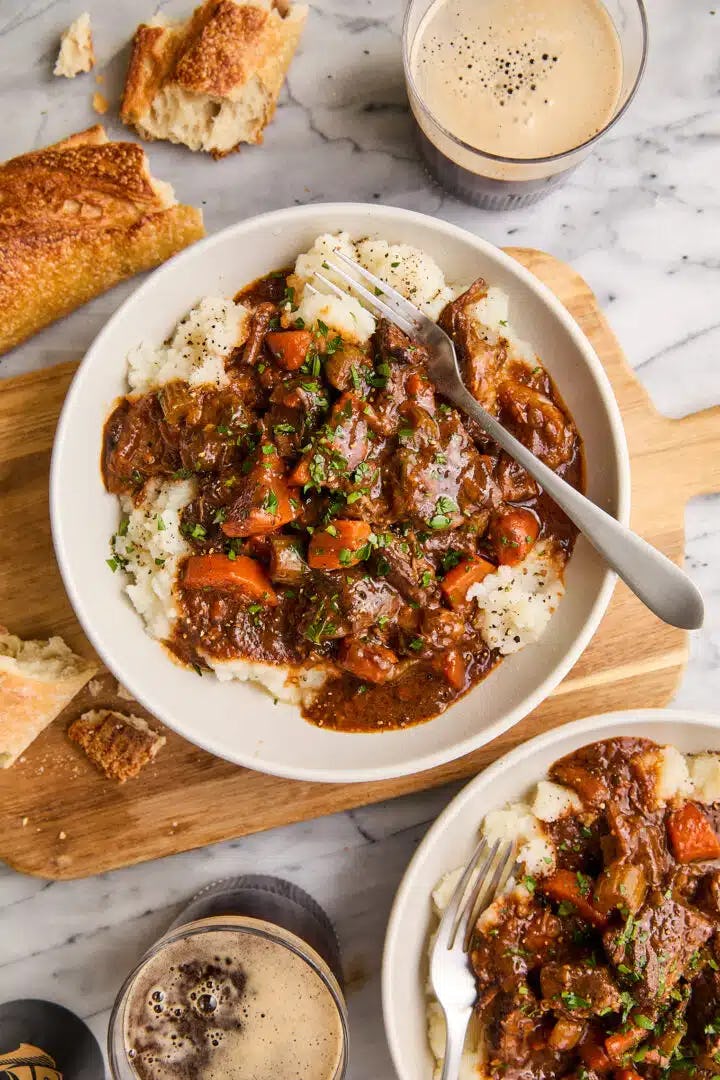 beef stew served over mashed potatoes in a story about easy st. patrick's day recipes