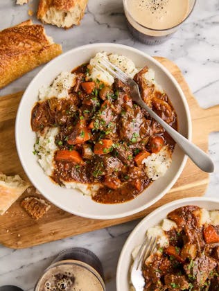 beef stew served over mashed potatoes in a story about easy st. patrick's day recipes