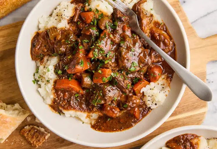 beef stew served over mashed potatoes in a story about easy st. patrick's day recipes