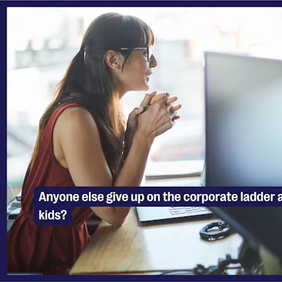 A woman sips a coffee while at her desk at work.