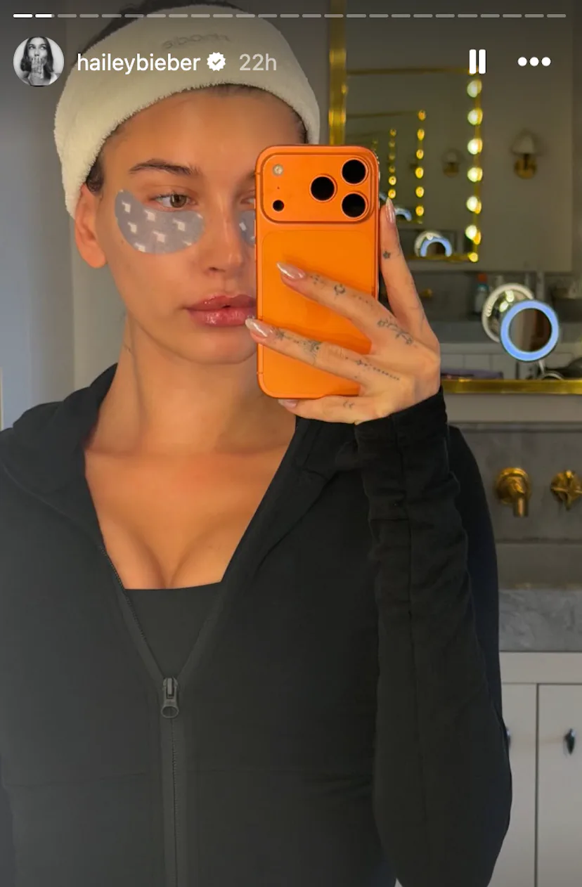 hailey bieber in a mirror selfie with soft chrome nails