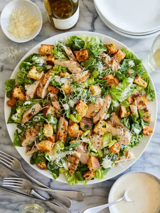 https://damndelicious.net/2023/04/21/best-chicken-caesar-salad-with-homemade-croutons/