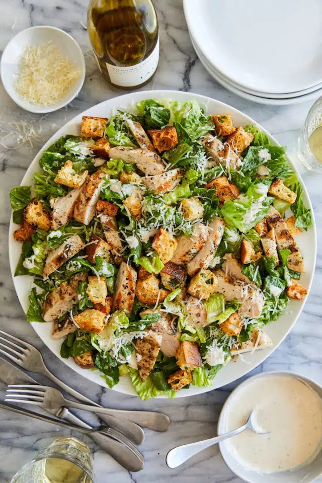 https://damndelicious.net/2023/04/21/best-chicken-caesar-salad-with-homemade-croutons/