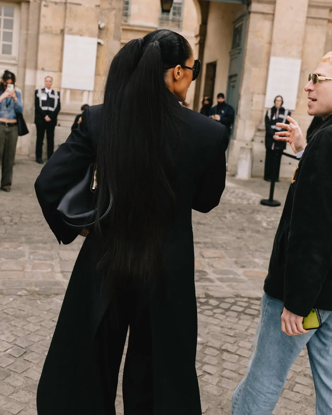 Tracee Ellis Ross with pigtails, seen from behind