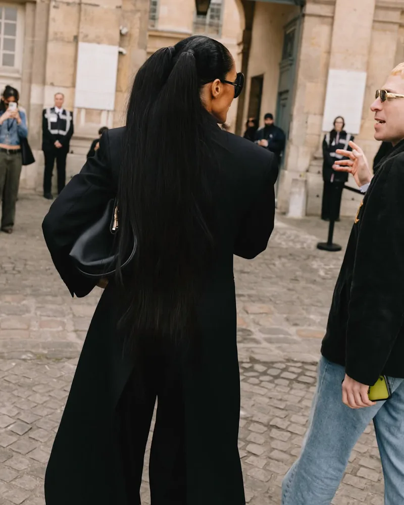 Tracee Ellis Ross with pigtails, seen from behind