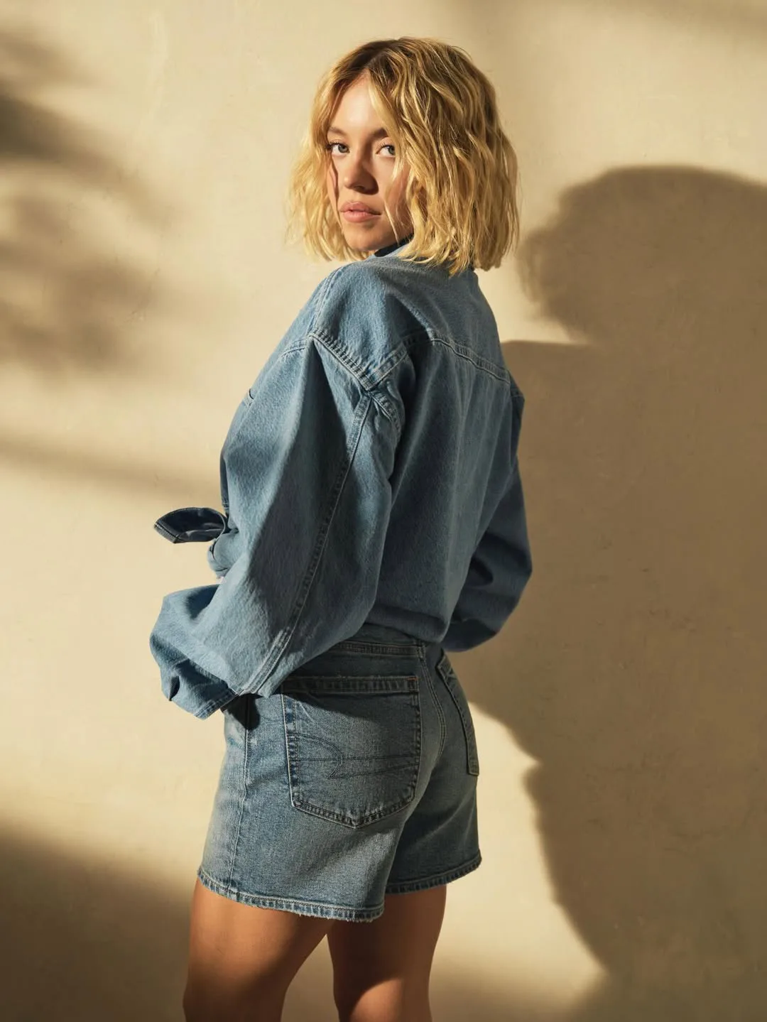 Sydney Sweeney wearing a summer Canadian tuxedo from American Eagle.