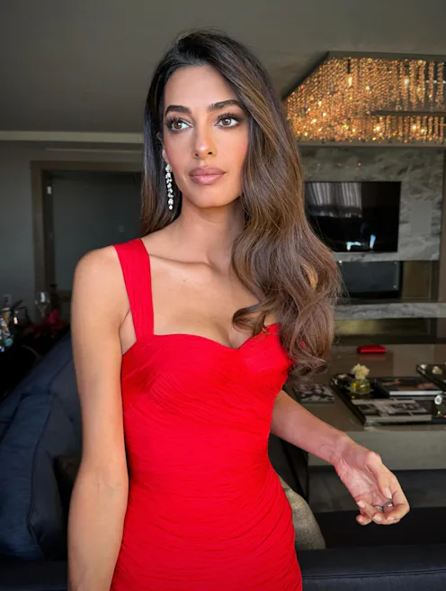 Amal Clooney wearing a red dress with red-carpet glam