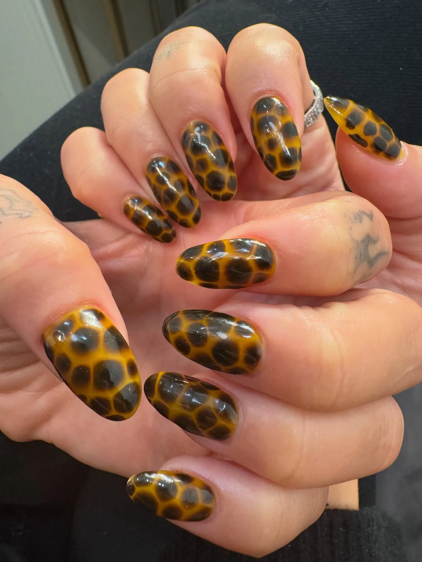 Close up of Dua Lipa's tortoise shell manicure