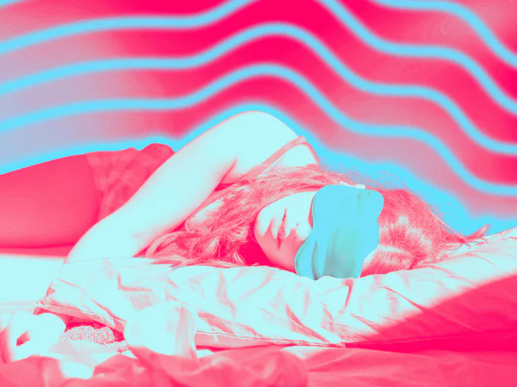 A woman laying down, testing TikTok's "sleepmaxxing" trend.