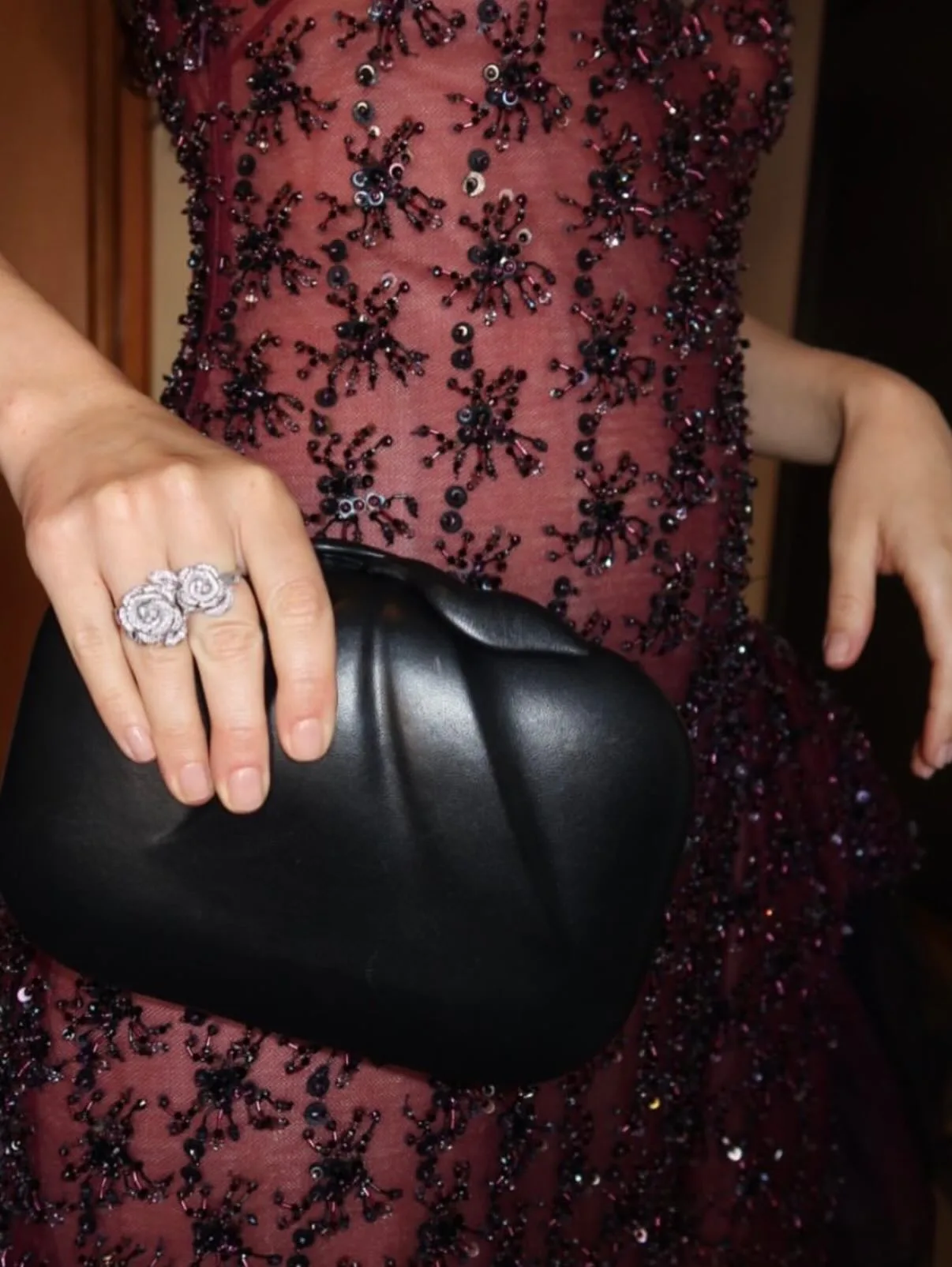 Mia Goth with a rosy nude manicure
