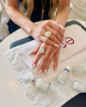 Close up of Rachel Zoe's liquid ivory manicure