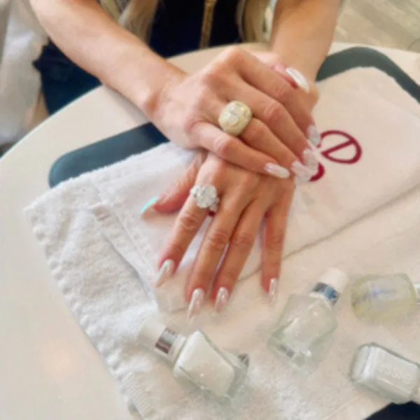 Close up of Rachel Zoe's liquid ivory manicure