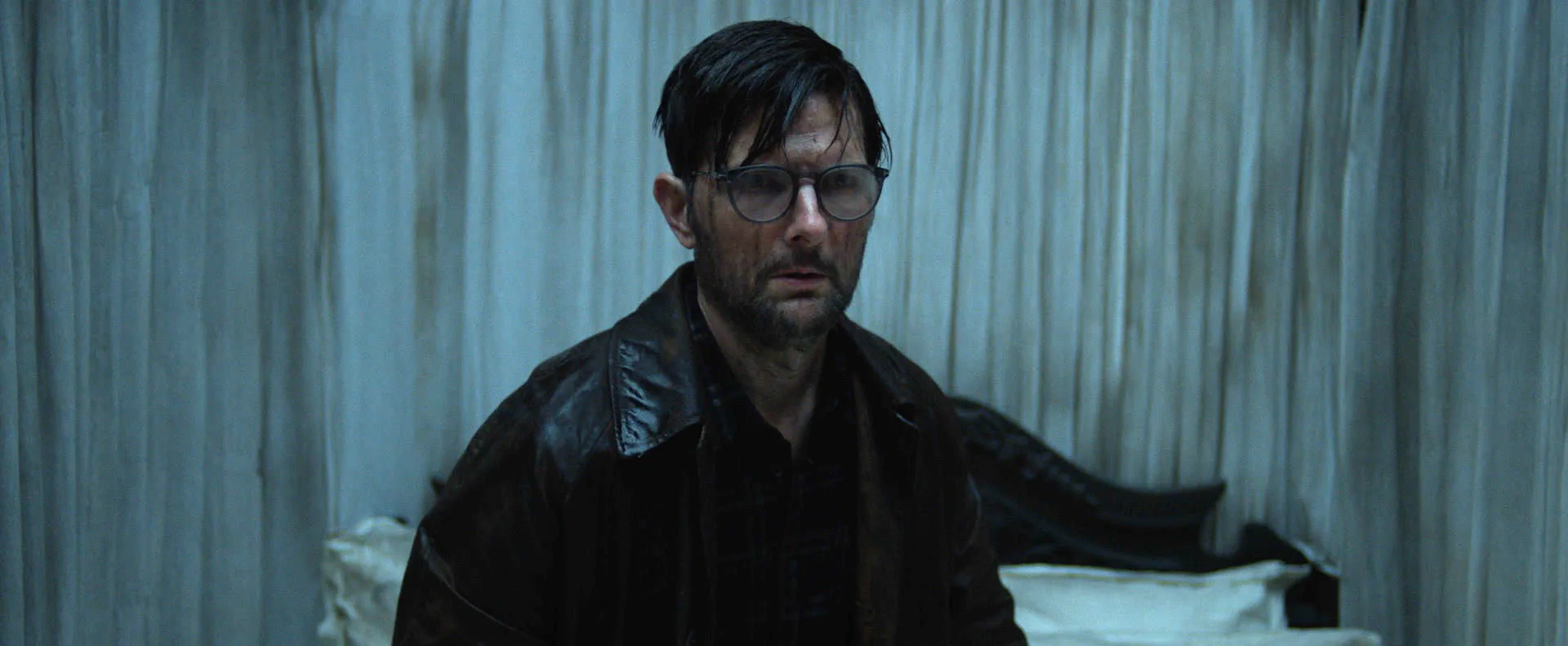 Adam Scott as Ohm Bauman in Hokum