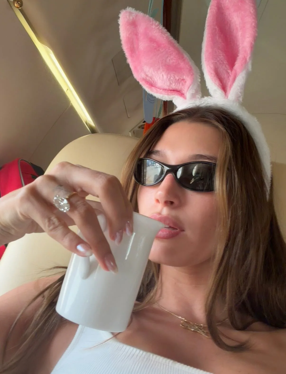 Hailey Bieber with a french vanilla glaze chrome manicure