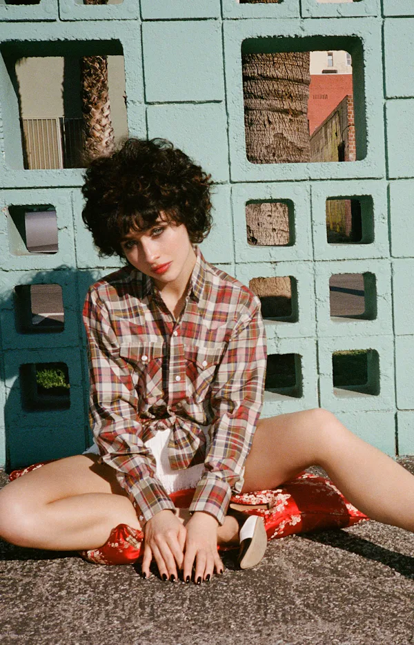 Sabrina Carpenter with black hair on the cover of Perfect magazine