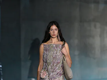 A model walks the runway at the Dior 2027 Cruise Collection Show held at LACMA on May 13, 2026 in Lo...