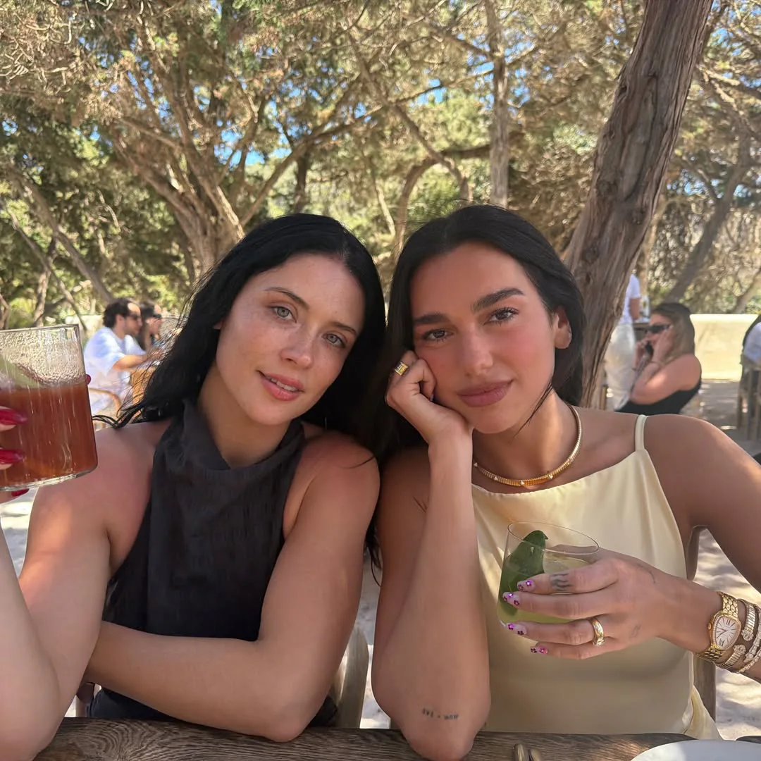 Dua Lipa with a friend, dining at a restaurant