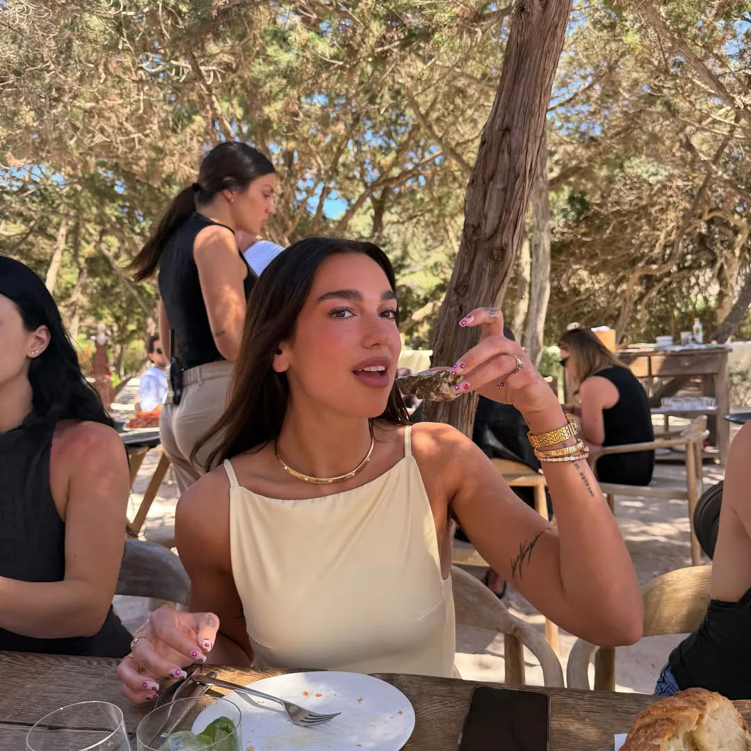 Dua Lipa eating shellfish