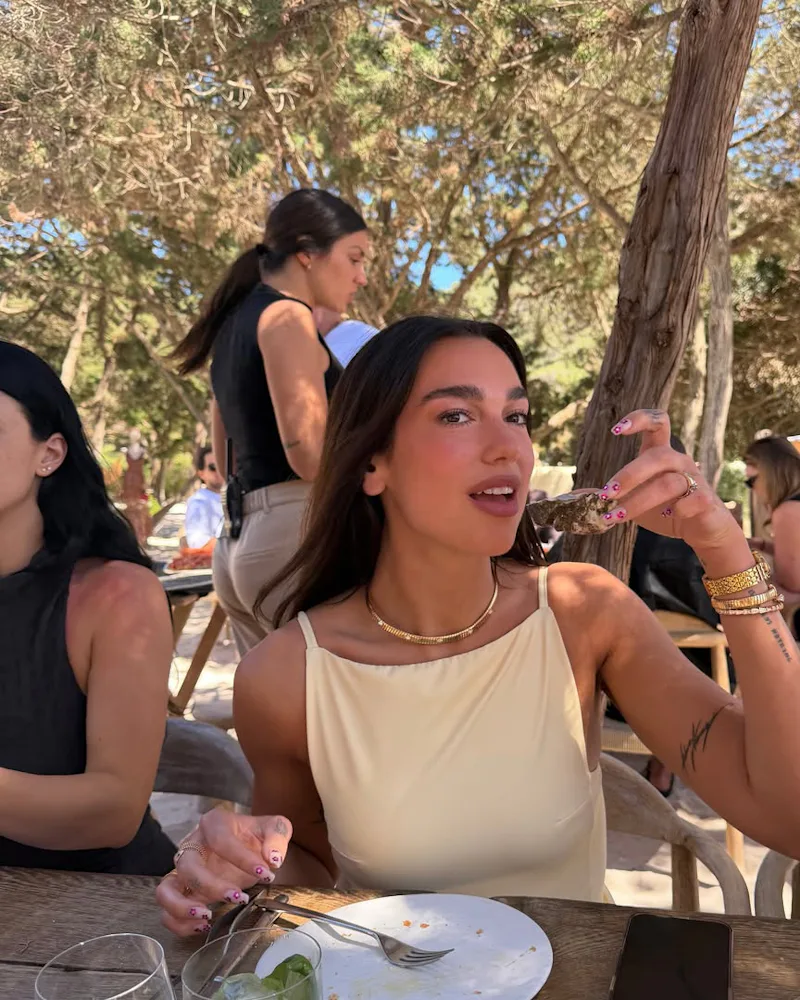 Dua Lipa eating shellfish