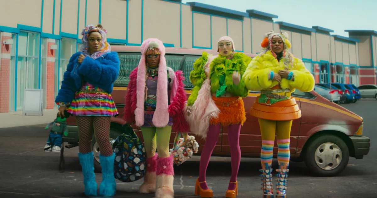 The Fashion In ‘I Love Boosters’ Has A Wildly Fun & Important Message