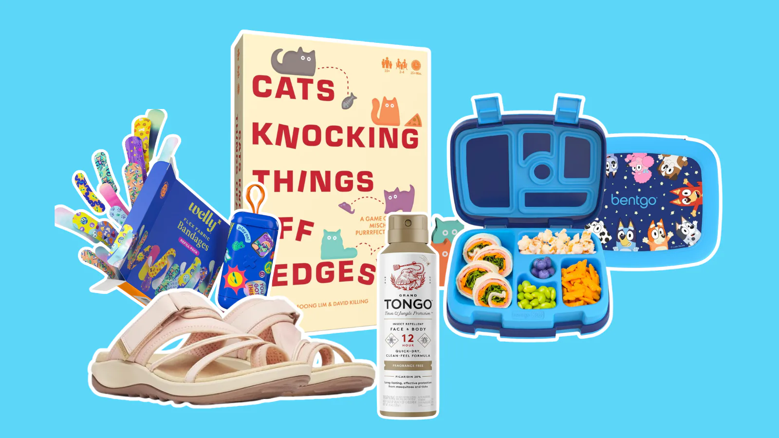 Flat lay of assorted items on blue background: children's sandals, sticker sheets, a boxed book titl...