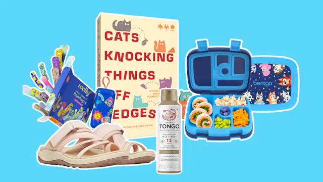 Flat lay of assorted items on blue background: children's sandals, sticker sheets, a boxed book titl...