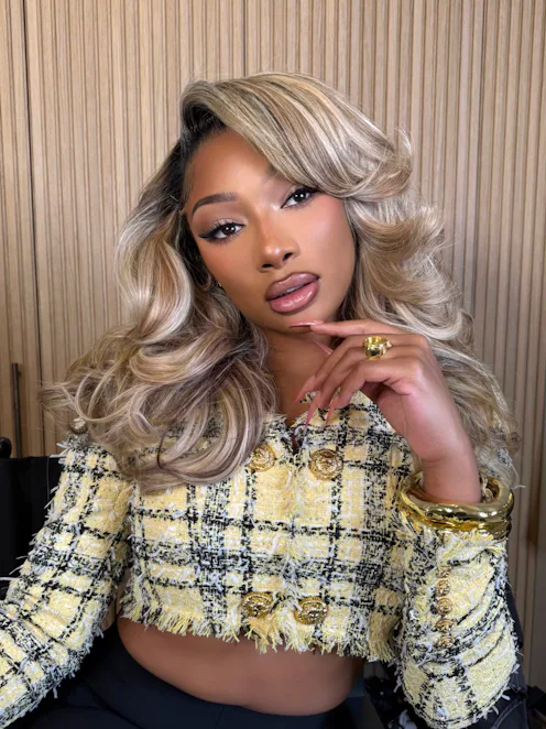Megan Thee Stallion with blonde hair and pretty glam makeup