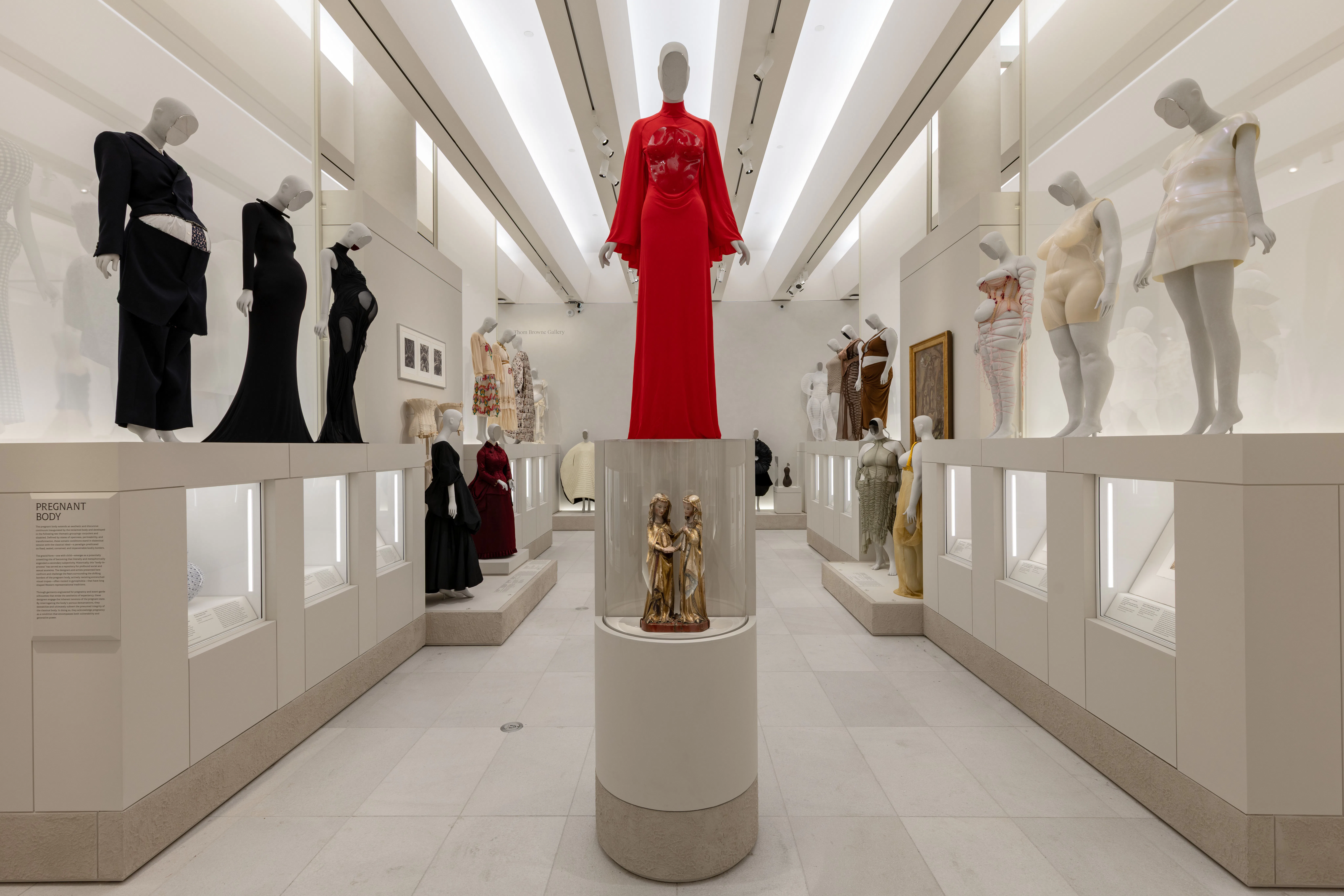 Gallery view of the Met's new Costume Art Exhibition. Left: Pregnant Body; Right: Corpulent Body. 