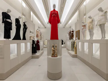 Gallery view of the Met's "Costume Art" exhibition. Left: Pregnant Body; Right: Corpulent Body.