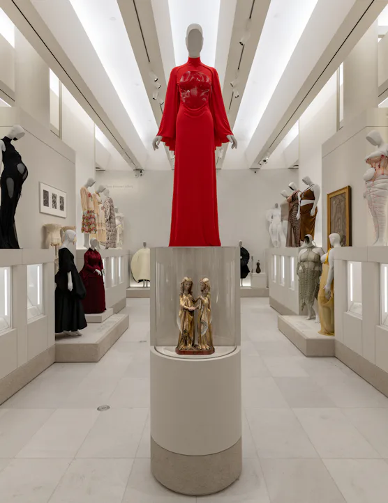 Gallery view of the Met's "Costume Art" exhibition. Left: Pregnant Body; Right: Corpulent Body.