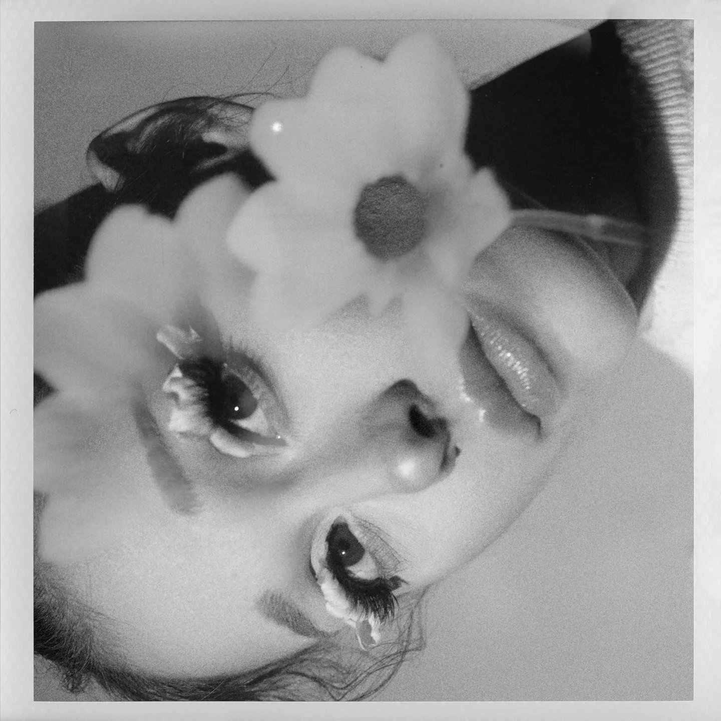Ariana Grande's "Petal" album cover, with actual petals in her eyelashes