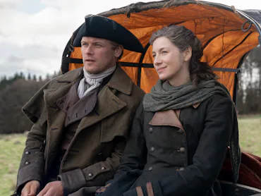 Sam Heughan and Caitríona Balfe as Jamie and Claire in Outlander. Photo via Starz
