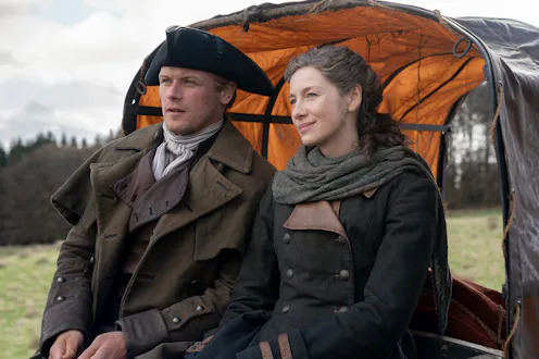 Sam Heughan and Caitríona Balfe as Jamie and Claire in Outlander. Photo via Starz