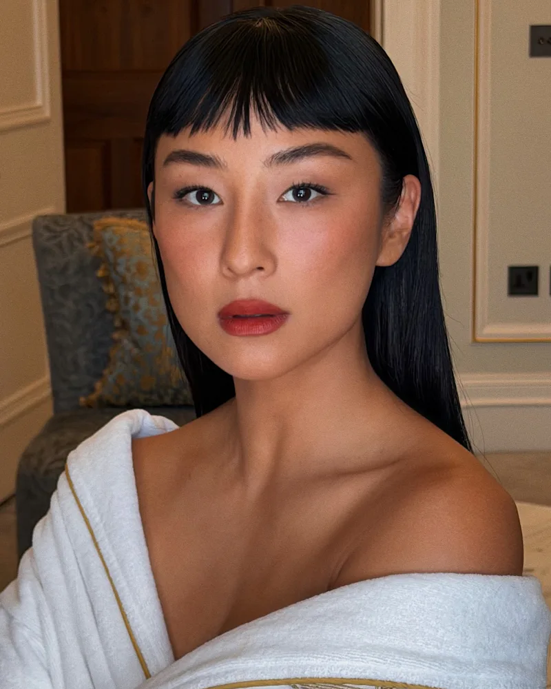 Greta Lee with micro bangs