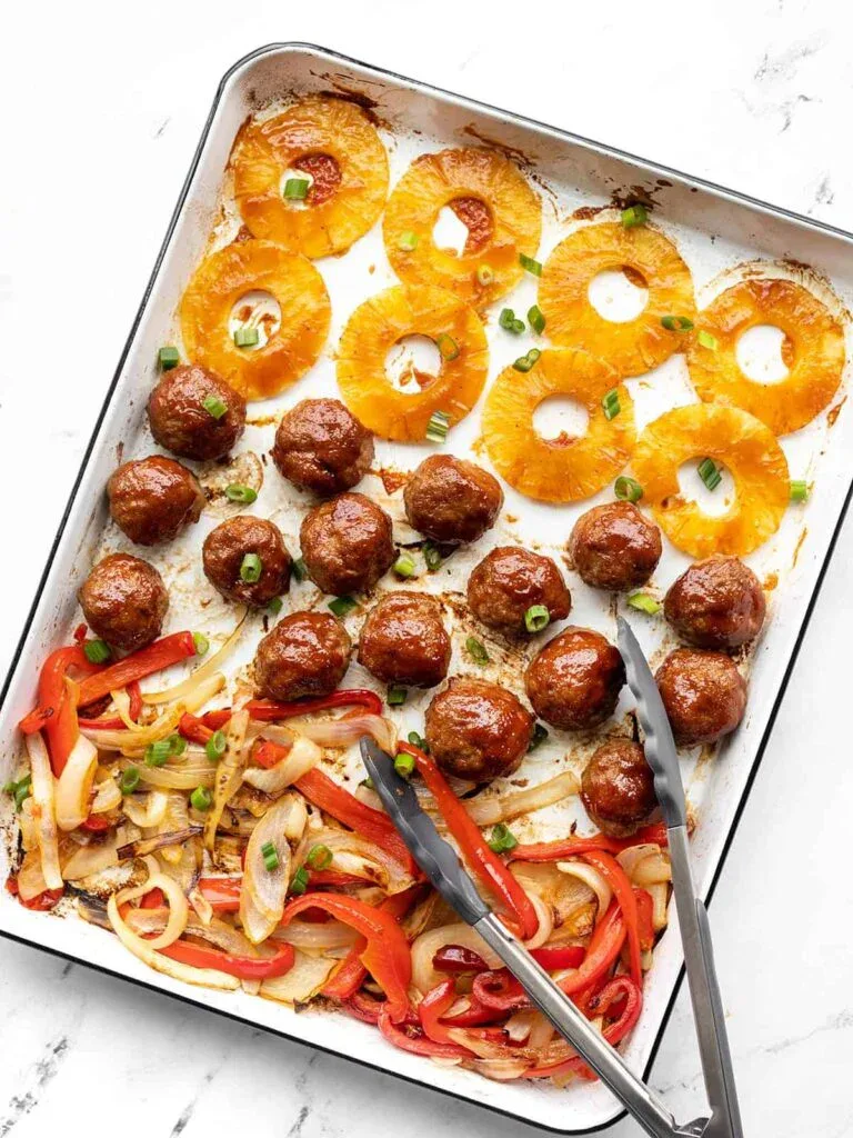 Sheet Pan BBQ Meatballs with pineapple rings and fajita veggies, an easy sheet pan dinner recipe.