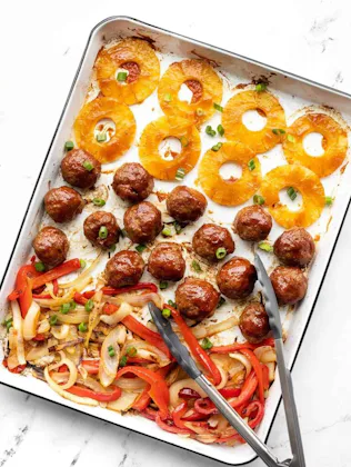 Sheet Pan BBQ Meatballs with pineapple rings and fajita veggies, an easy sheet pan dinner recipe.