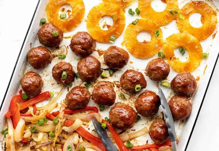 Sheet Pan BBQ Meatballs with pineapple rings and fajita veggies, an easy sheet pan dinner recipe.
