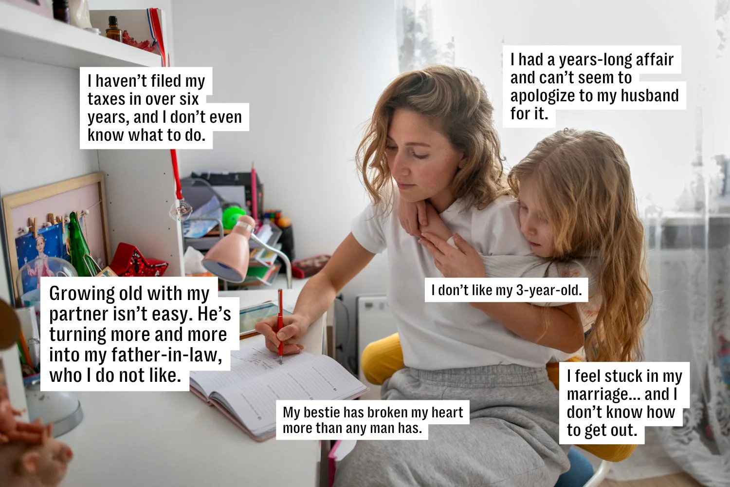 Woman sitting at a cluttered desk, writing in a notebook while a young child sits on her lap; speech...