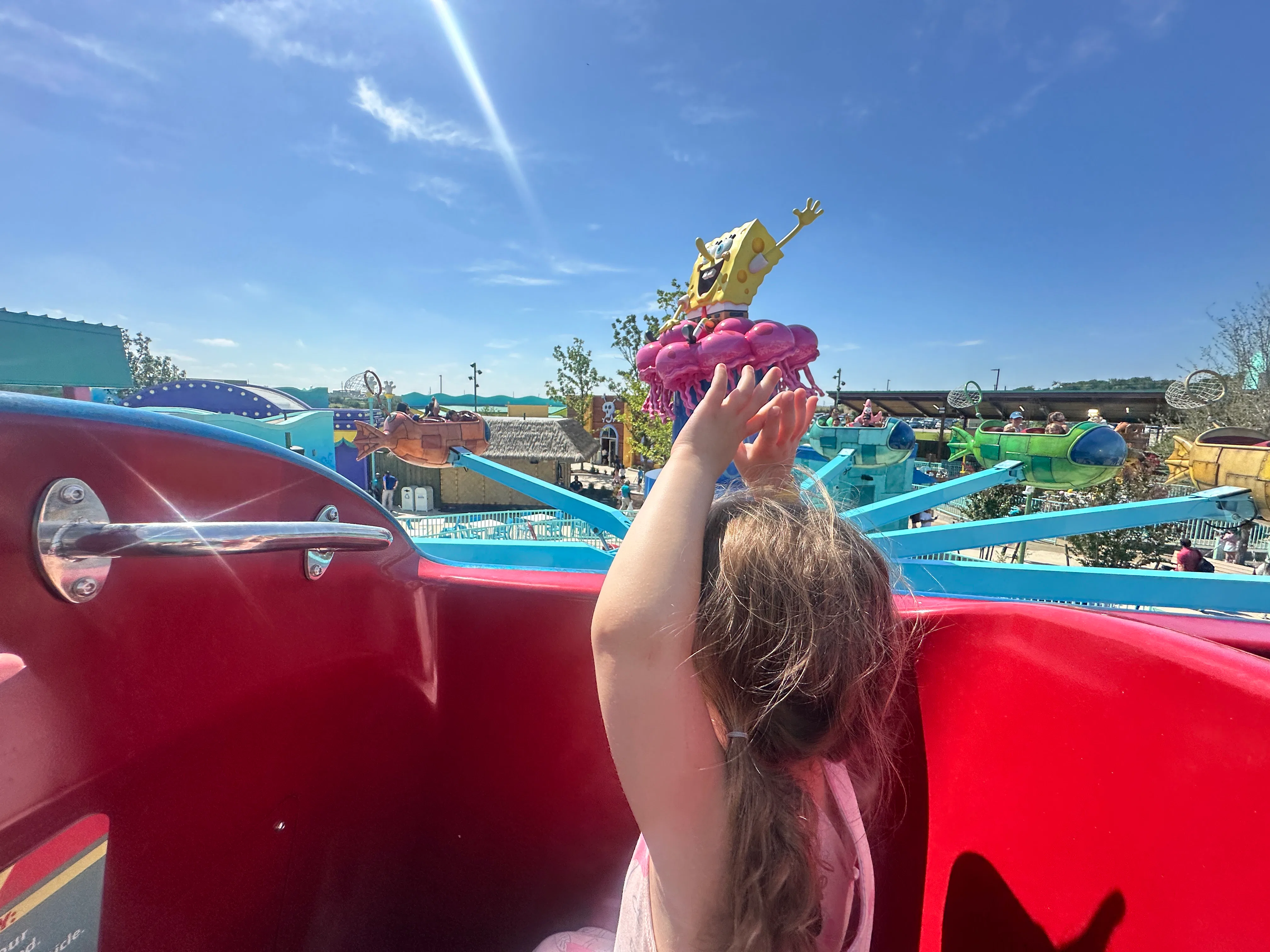 A little girl rides a ride at the new Universal Kids Resort in Texas