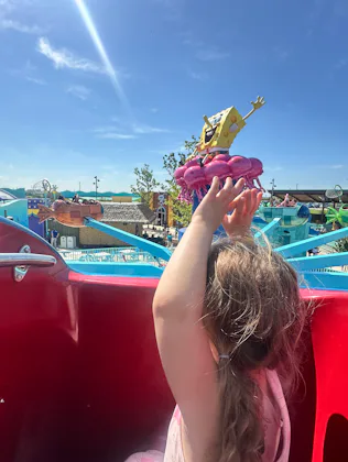 A little girl rides a ride at the new Universal Kids Resort in Texas