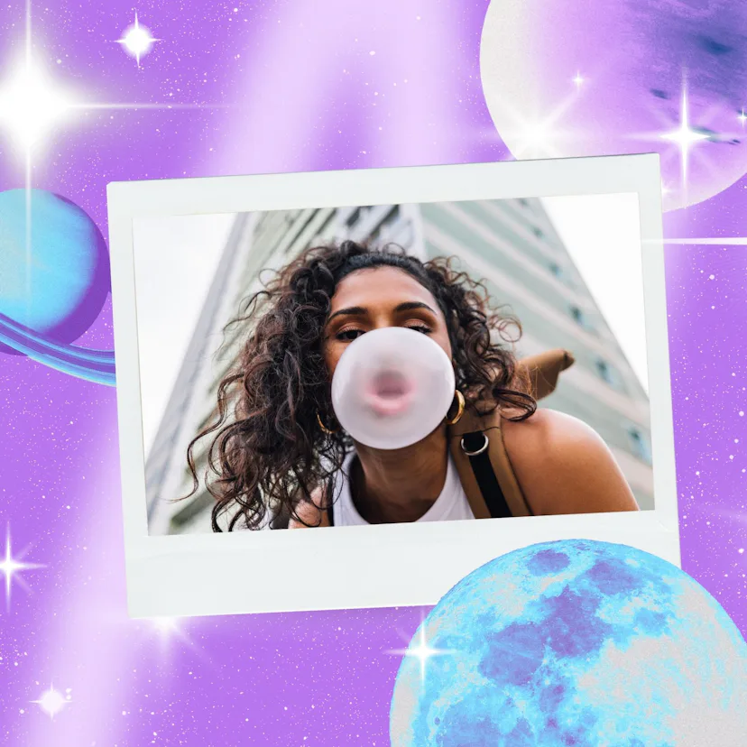Young woman blowing a bubble before reading her July 2026 horoscope.