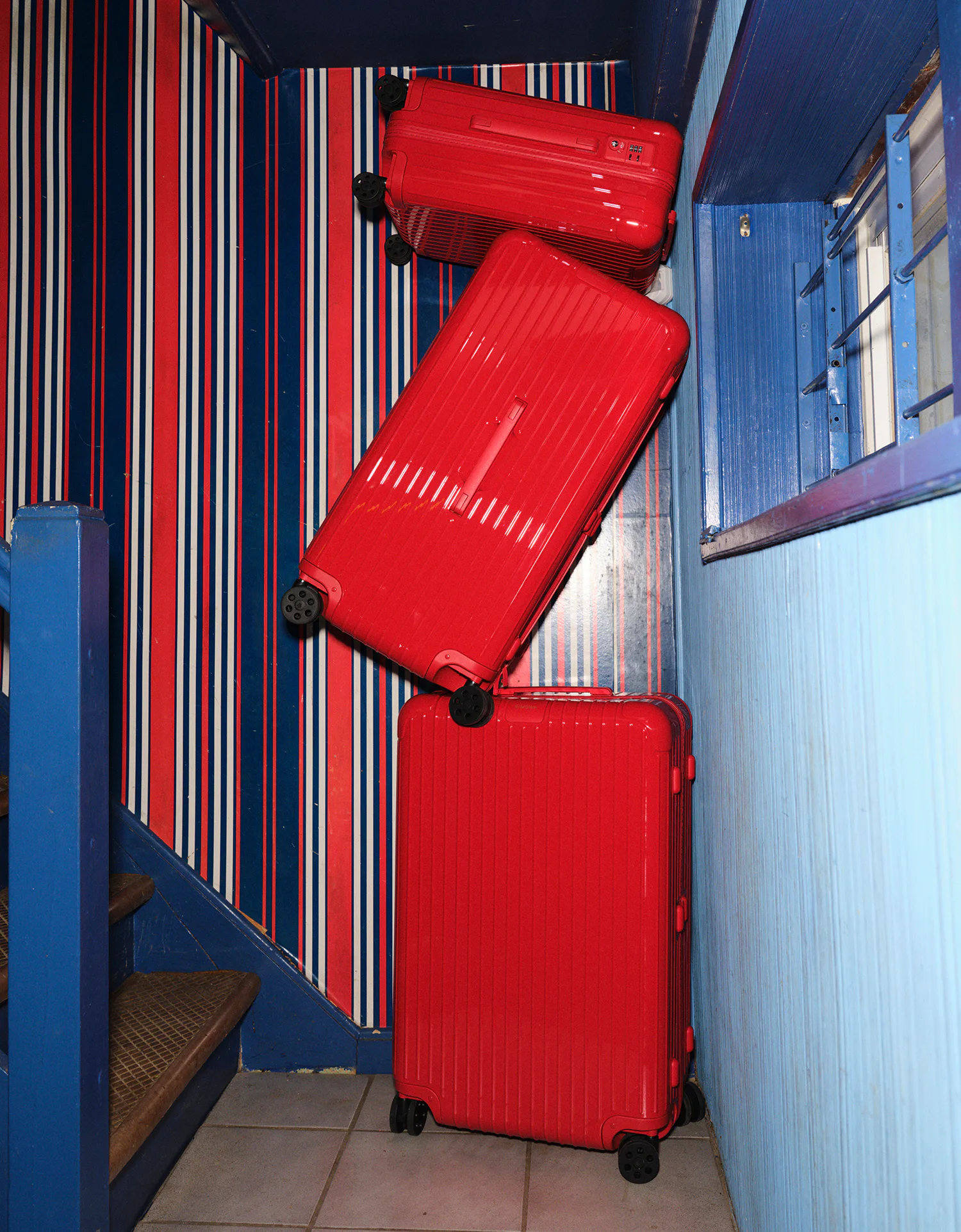 a stack of red suitcases