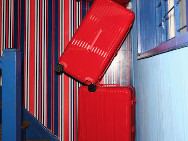a stack of red suitcases