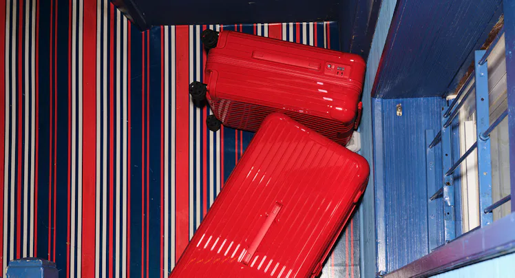 a stack of red suitcases