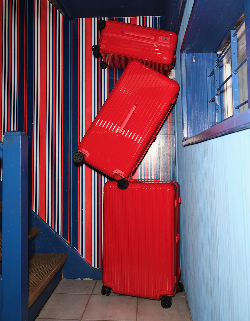 a stack of red suitcases