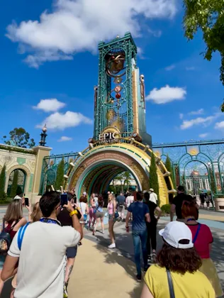 A crowd walking into the entrance of Epic Universe, in a story about what to know before your first ...