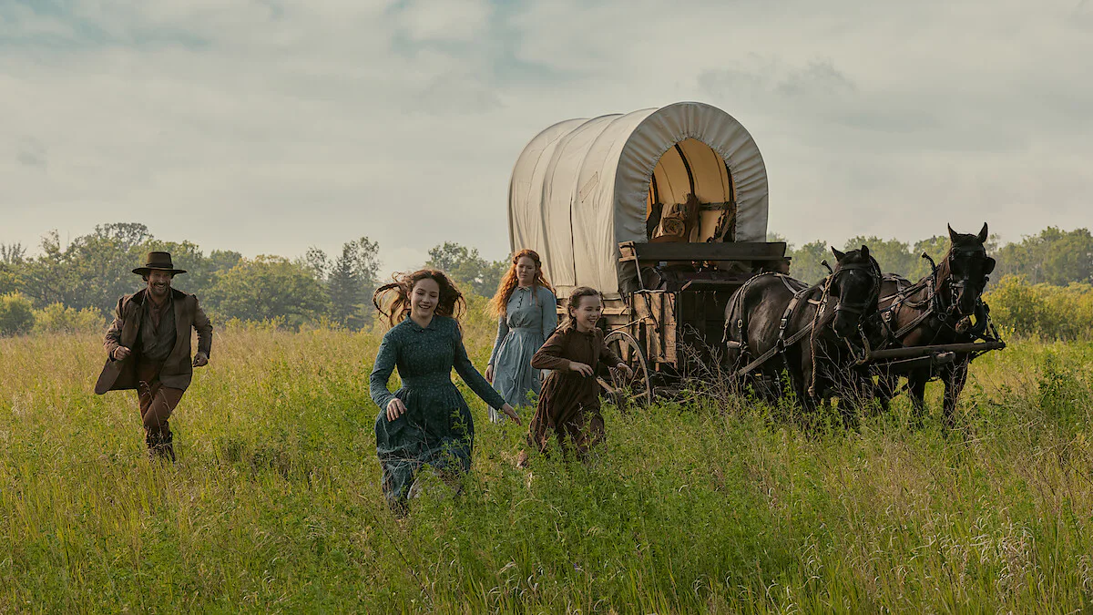 Netflix's Little House in the Prairie screen grab of the ingalls family running through a field.