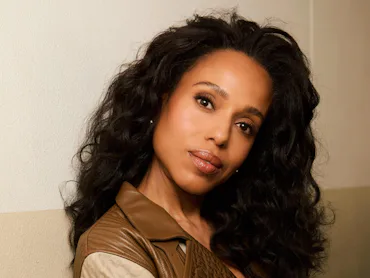 Kerry Washington wearing neutrals with curly hair
